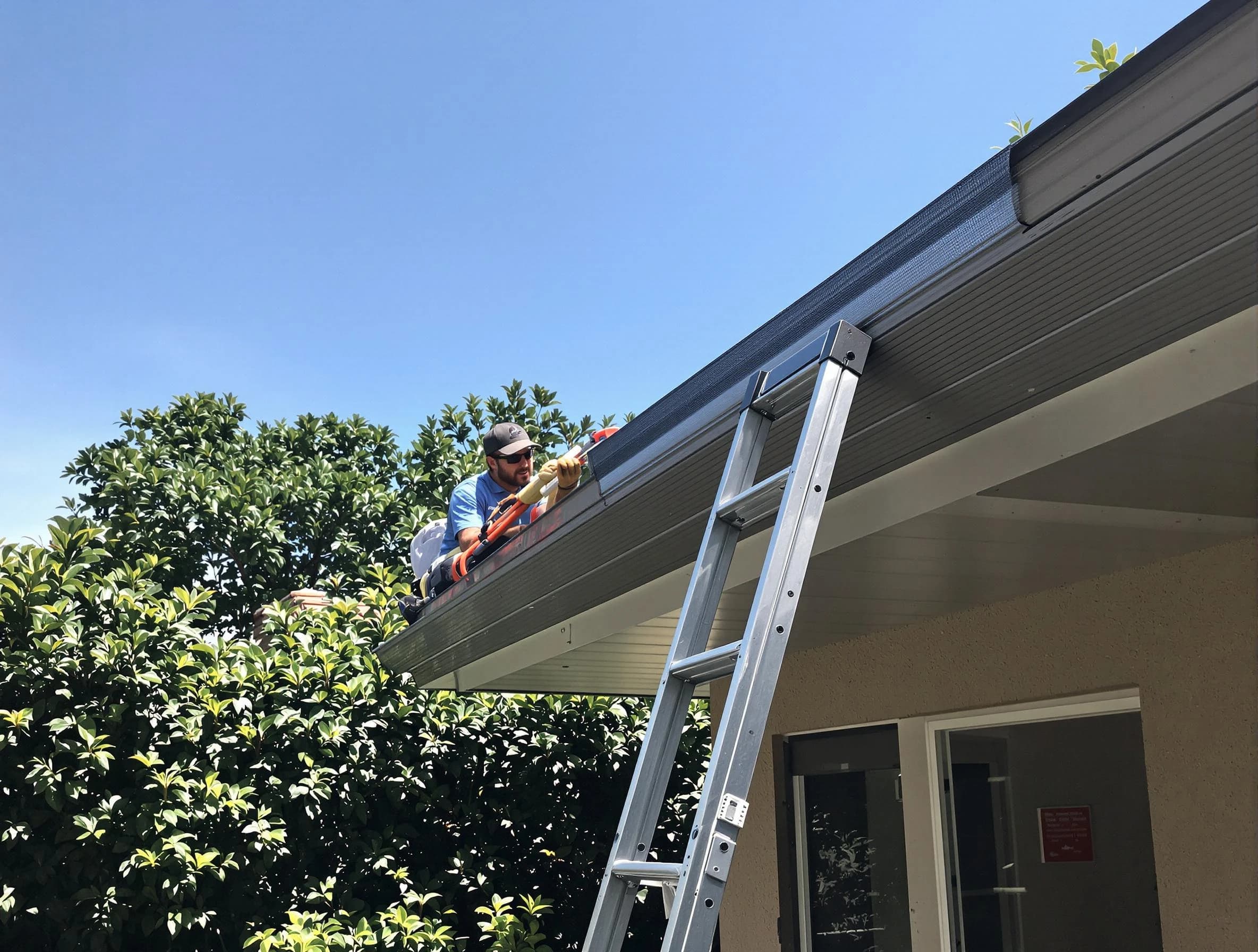 North Royalton Roofing Company installing gutter guards for a homeowner in North Royalton, OH